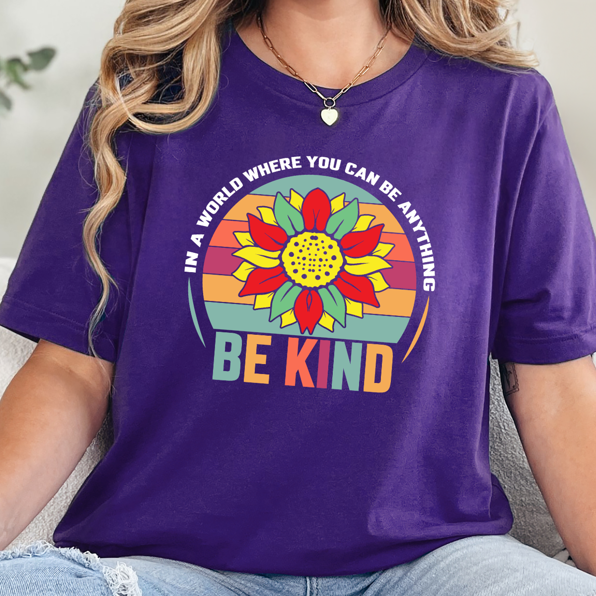 Wholesale In A World Be Kind Graphic Tee - Team Purple Tee