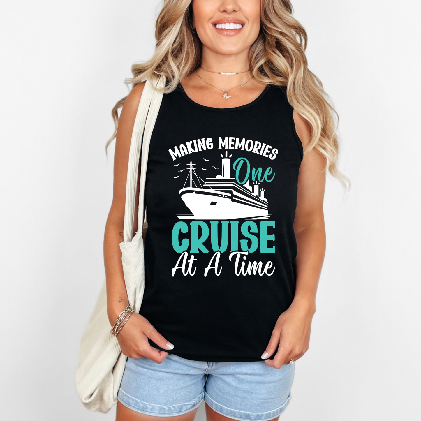 A woman wearing a black sleeveless T-shirt with the text 'MAKING MEMORIES One CRUISE At A Time' printed on the front.