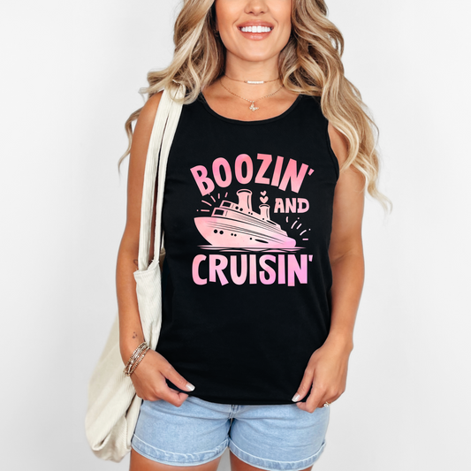 Woman wearing a black tank top with pink text and graphics.