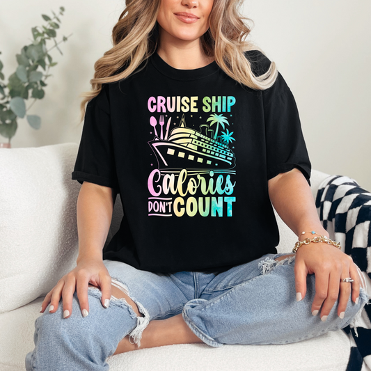 Person wearing a black graphic t-shirt with a cruise-themed design.