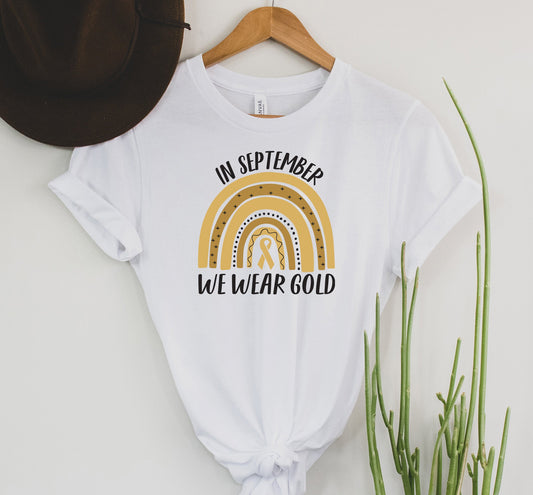 Wholesale We Wear Gold Yellow rainbow - Childhood cancer Graphic Tee - White